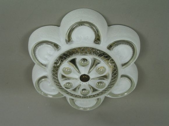 #1-1965 A flower shaped clear and milk glass flush mount.