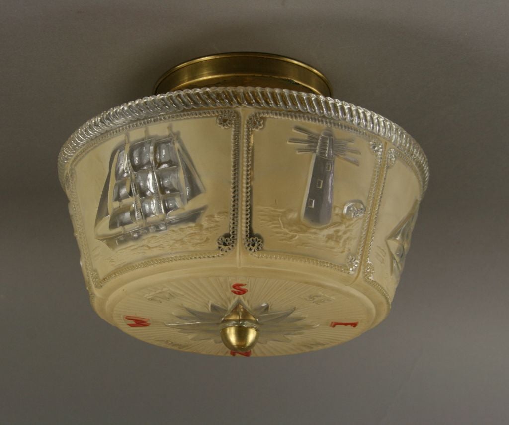 #1-2364abc Embossed glass with ships on border and compass directions on bottom 2   60 watt edison based bulbs
Priced individually