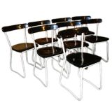 set of 8 dining chairs by Guyot
