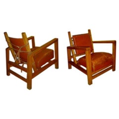 pair of club chairs by J Adnet
