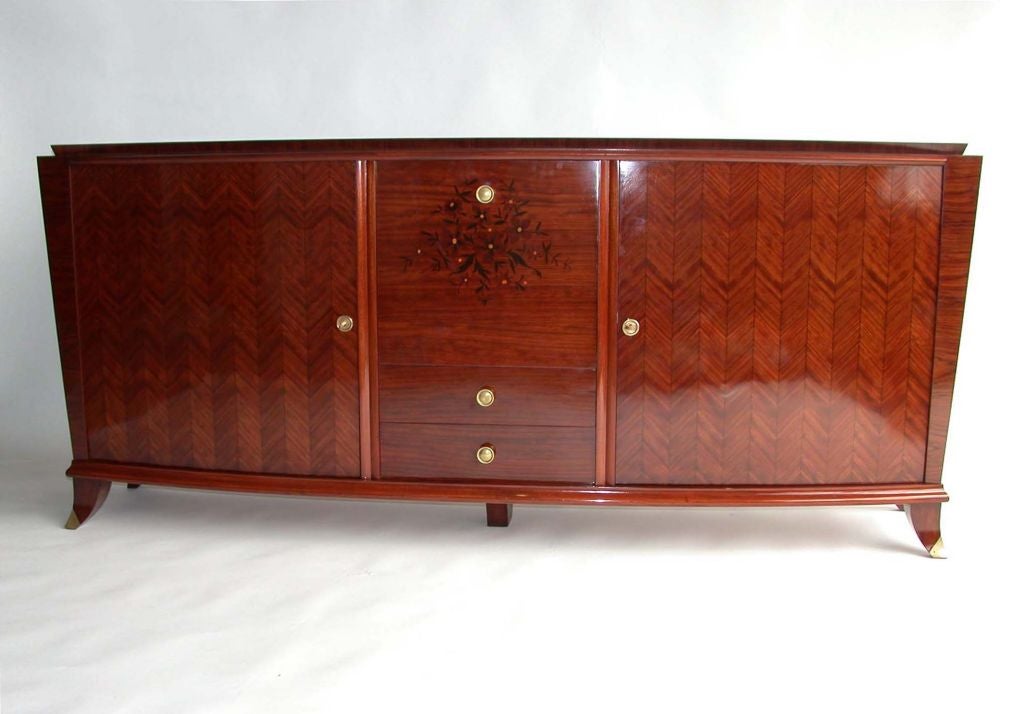 With a fine marquetry and mother of pearl inlays, a central folding door, two drawers and bronze details.