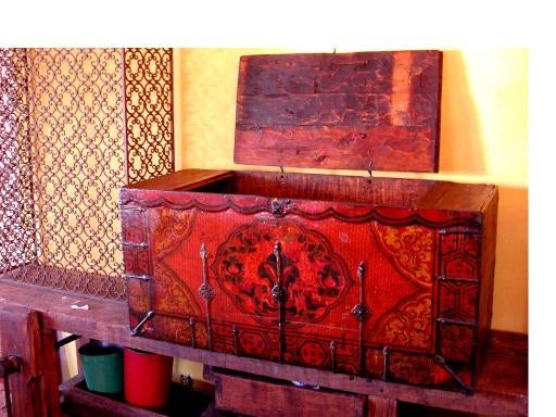 SOUTHERN TIBETAN (LOCA REGION) PAINTED MONASTIC TREASURE CHEST. THESE WERE TYPICALLY USED FOR HOLDING VALUABLE AND SACRED ITEMS. BORDER DESIGN IS A PAINTED STYLIZATION OF ANCIENT LACQUER DESIGNS. CENTRAL CARTOUCHE IS A DEPICTION OF THE THREE