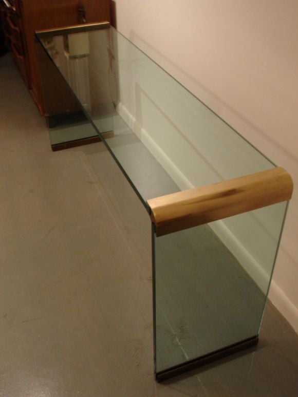 Brass and glass waterfall console.
