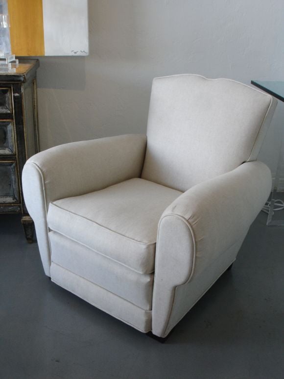 Linen covered mustache back french club chairs.