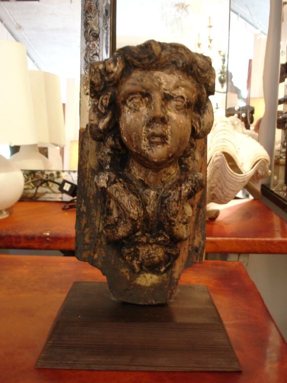 Beautifully carved Italian putti ornaments in the baroque style. Mounted on new wooden bases.measurements include bases.