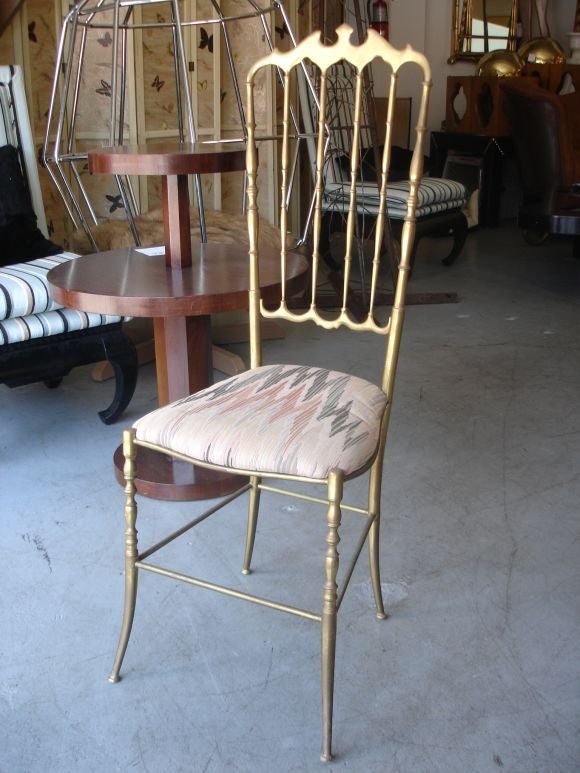 Pair of hollywood regency style Chiavari brass chairs from Italy circa 1950's.