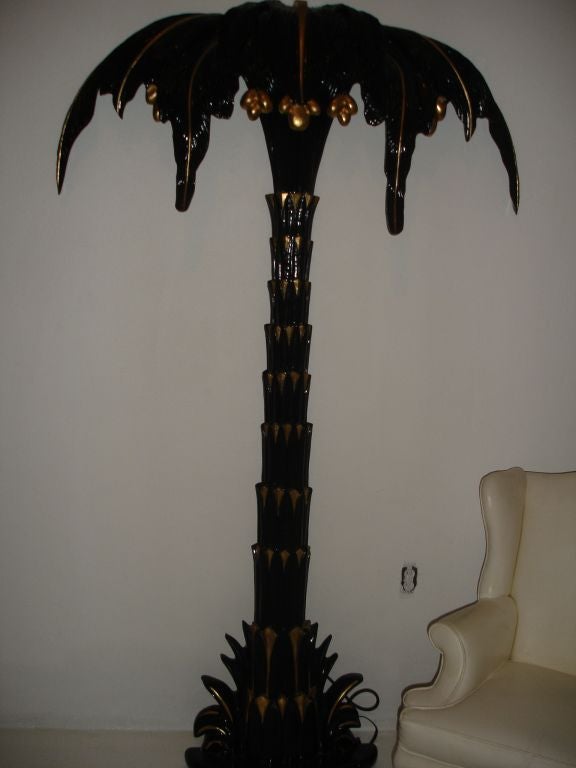 A great wall mounted painted palm tree torchere. Probably repainted at some point.