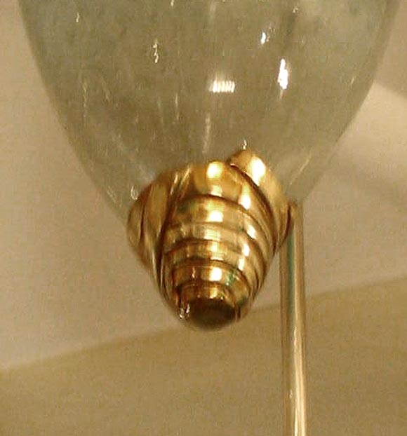 A great handblown Murano glass chandelier with a 24-karat gold fixture. Sculptural sockets and fittings.