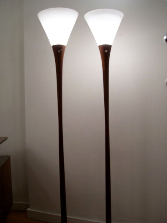 A sleek pair of 1960's Danish torchieres in teak with milk glass shades. PRICE FOR PAIR