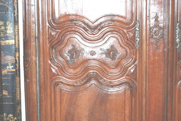 Beautifully carved 18th century Armoire with exceptional patina.