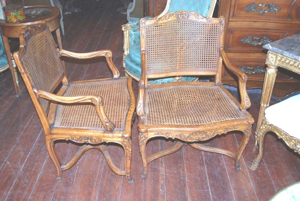 Carved and Caned Walnut Armchairs