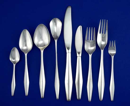 A set of sterling silver flatware, designed by Gio Ponti for Reed & Barton, in the Diamond pattern.  Priced at $675 per five-piece place setting.  Eighteen (18) place settings available.
Each place setting is comprised of a dinner knife, dinner