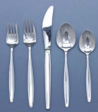 A five-piece place setting in the Cypress pattern designed by designed by Tias Eckhoff for Georg Jensen in 1953. In sterling silver.  Includes dinner knife, dinner fork, salad fork, teaspoon and tablepoon.  

Priced at $650 per place setting (five