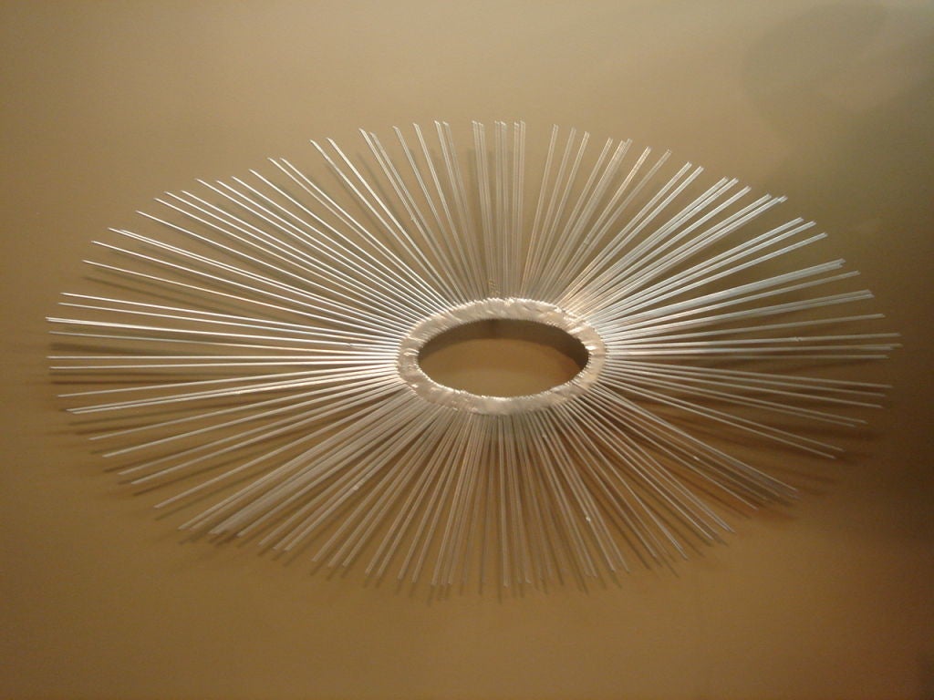 A starburst wall sculpture designed by Curtis Jere.  Circa 1970.  Unsigned.  Made of silver gilt metal.<br />
<br />
May be viewed at The Showplace, 40 West 25th St., Third Floor, New York, NY 10011.