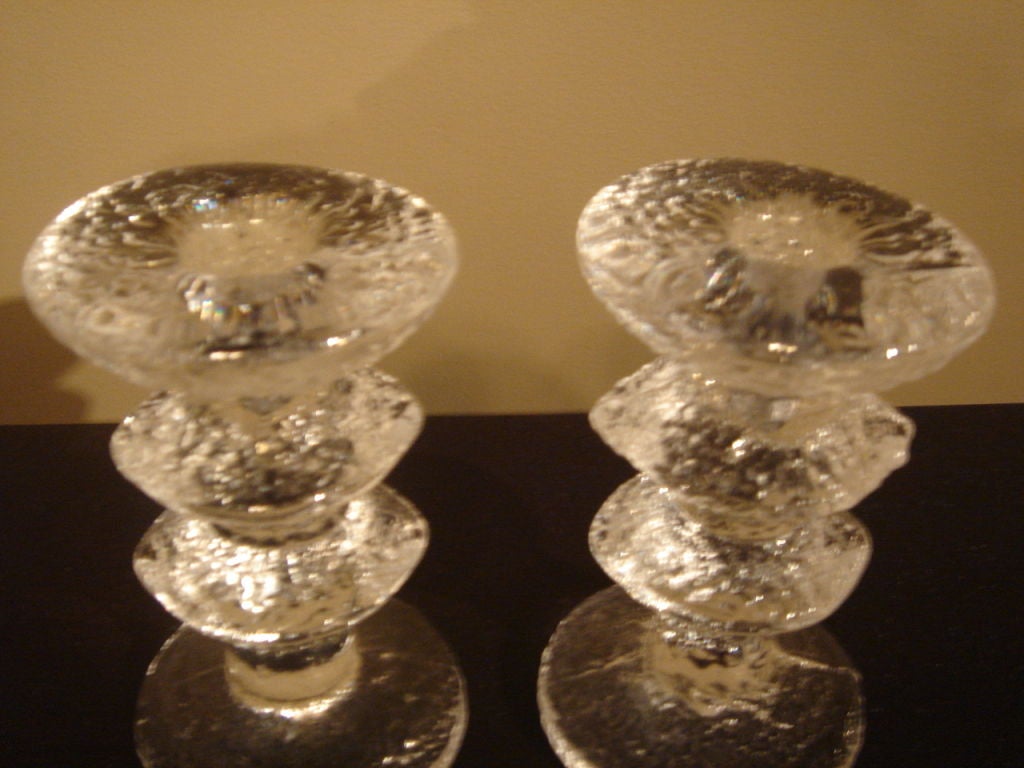 A bold pair of glass candelsticks in the Festivo pattern by Timo Sarpaneva for Iittala.  Signed with designers initials 