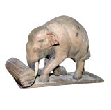 A CHARMING INDIAN CARVED WOODEN STANDING ELEPHANT