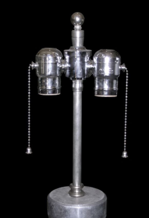 PAIR OF AMERICAN ART DECO POLISHED CAST ALUMINUM LAMPS