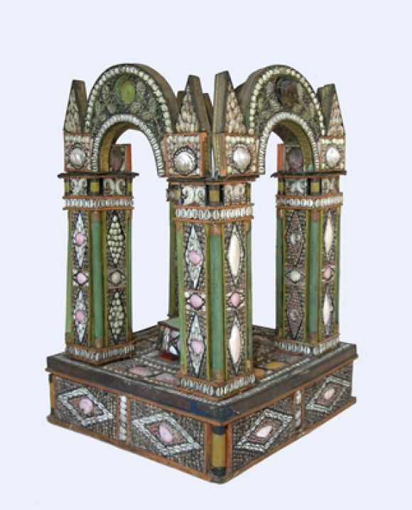 A DELIGHTFUL FANTASY ITALIAN BAROQUE STYLE SHELL-APPLIED PAPER ARCHITECTURAL TEMPIETTO MAQUETTE WITH FOUR BOLD CONJOINED ARCHES ABOVE A SQUARE PLINTH.The square base raising a reduced plinth of square section; centered by four corner columns of