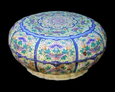 AN INSPIRED CHINESE CANTON ENAMELED COPPER YELLOW GROUND LOTUS-FORM COVERED SWEETMEATS BOWL WITH NINE ENAMELED INTERIOR DISHES ON A TURQUOISE GROUND.The circular bowl with serpentine, lotus-petal circumference; raised on a reduced, undulating foot;
