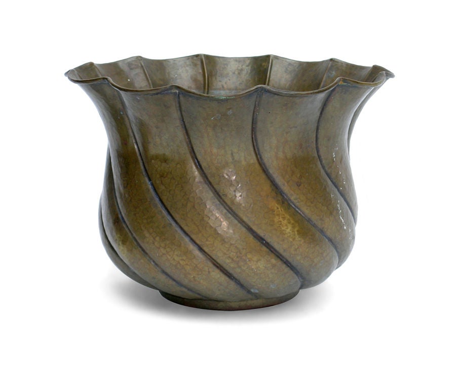 AN ITALIAN ART DECO BRASS REPOUSSE PLANTER.