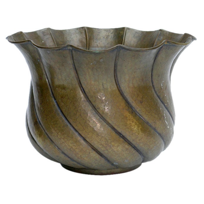 AN ITALIAN ART DECO BRASS REPOUSSE PLANTER by Casagrande