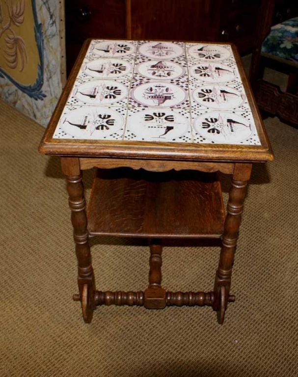 Dutch oak trolly table, circa 1900 with 18th century puce delft tiles.