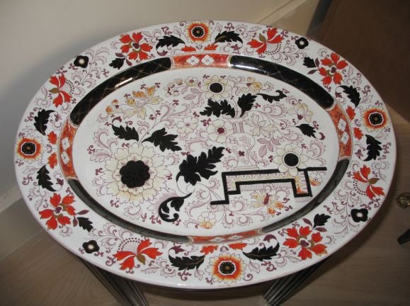 A great oval English Ironstone Platter by Ashworth mounted on a later custom ebonized stand.  The platter made about 1870.