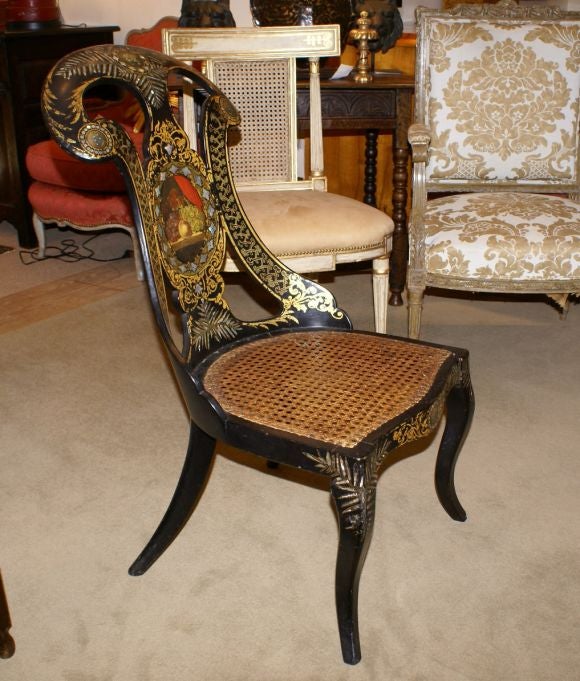 Amazing top quality papier mache' gondola chair in black lacquer with mother of pearl inlay, decorated in gilt with panels featuring still life paintings.