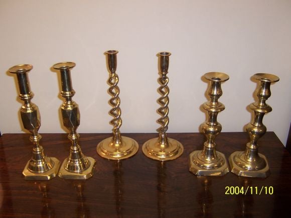 English brass candlesticks are $345 pair, all are c 1880 or earlier, open barley twists are the exception, dating from c.1910.  Contact us for a larger selection or brass candlesticks, antique letter holders, inkwells, etc., to accessorize a desk or