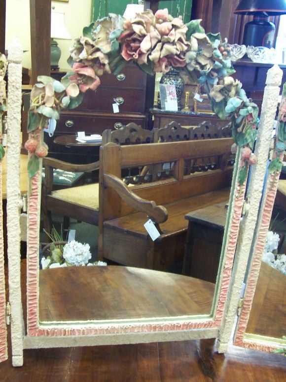 This is a large and unusually decorative Barbola, in triptich form, with leather flowers.  The exhuberant flowers are in pastels, with gesso pink ribbon.  Reduced from $1,250.