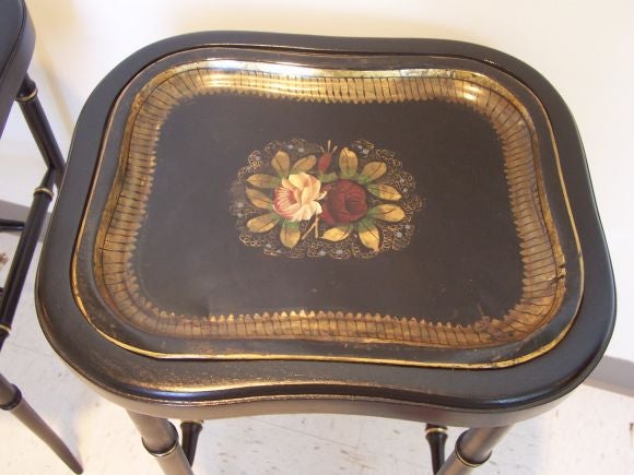 Elegant pair of antique hand-painted floral trays from England on newly constructed stands made to match with black and gold paint.<br />
<br />
This item is currently at our Manhattan location. Please call 914-381-0650 or email us at