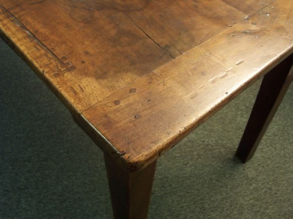 Elegant antique French country dining table. The walnut has a rich, warm finish.  While the table is narrow, seating for 8 is comfortable as the chairs on the sides can be well-spaced. The apron height provides 24 1/2