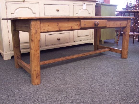 Antique Irish pine coffee table. Generous size. Pine is distressed with a warm, honey finish.  The stretcher is typically Irish.
