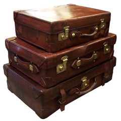 Stack of Three Antique Leather Suitcases