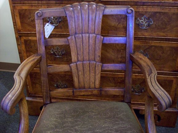 Pair of vintage yacht or ocean liner armchairs, recently from Helmingtran Hall in England (where the Queen visits!). The shaped arms, with scrolls,  and the fabulous deco back give a very good look.  The mahogany has a warm, aged. Seats are drop-in,