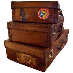 Stack of Three Antique Leather Suitcases