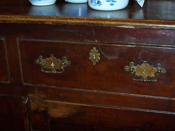 A beautifully worn early English hutch, just great color and patina.  This hutch has good storage and a big top shelf for large platters.  Original handles.  Reduced. NT