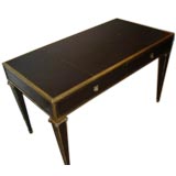 A Brass Trimmed French Leather Desk in the Neo-Classical Style