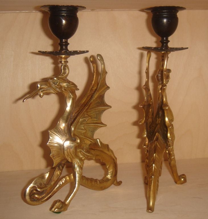 Unique pair of brass dragon candlesticks