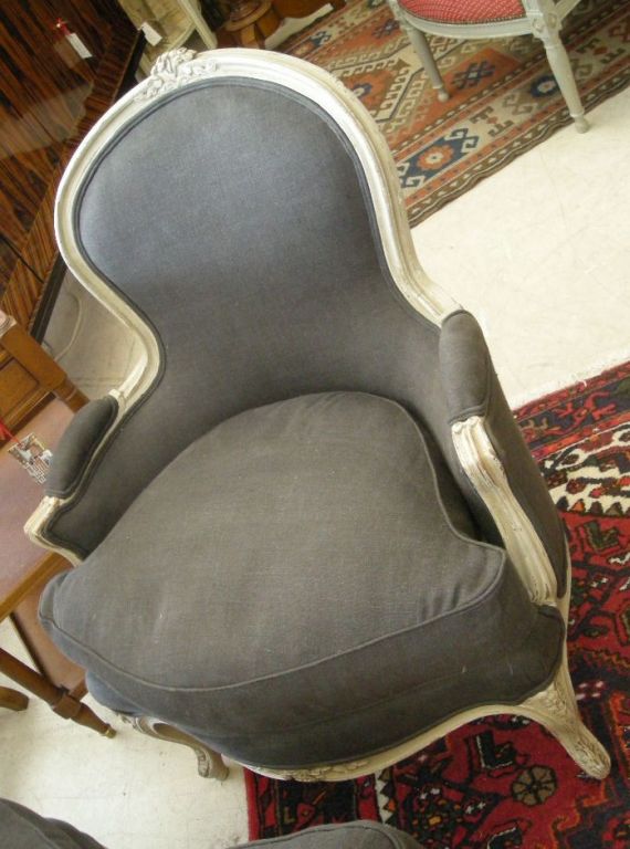 Louis XV-Style two-piece painted and hand carved Duchesse Brisée with removable seat cushions; upholstered in grey linen fabric and carved with a single floral design.