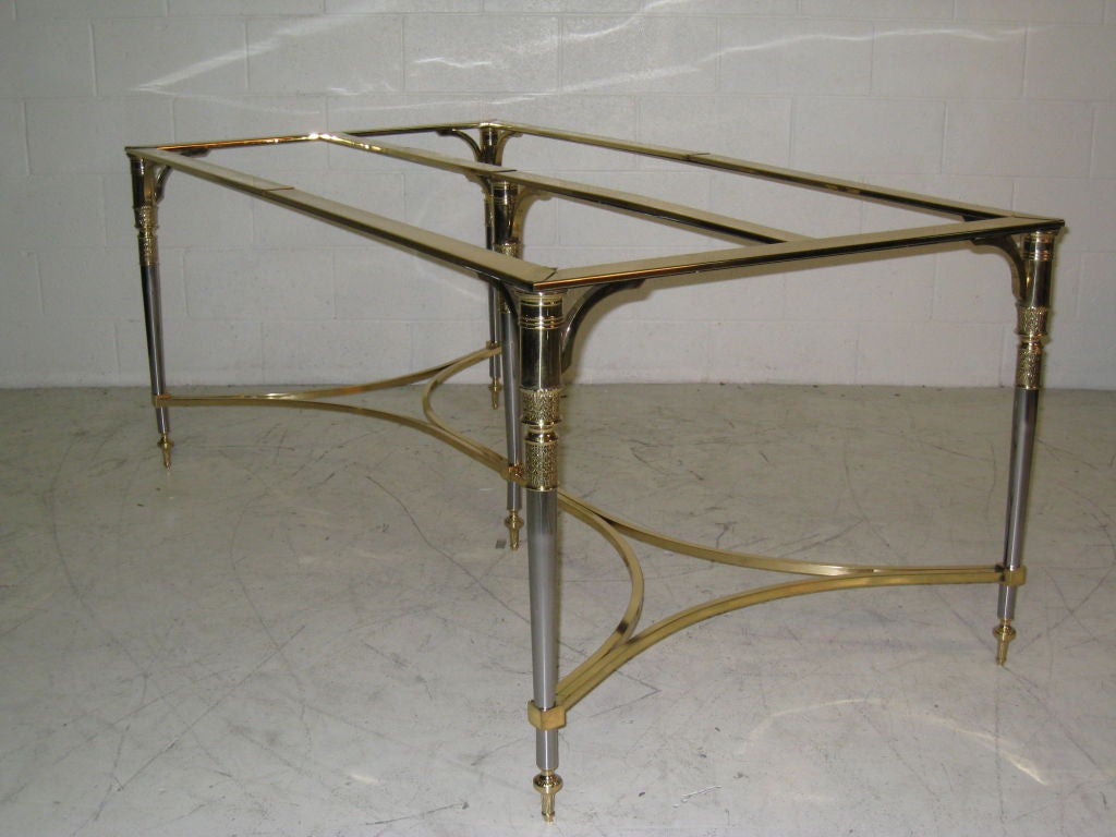 Italy, Polished Steel and Polished Brass Table.  Table has removable Brass Covers for the top of the Table to accomodate a Glass Top and removed to receive a Stone or Marble Top.  Can be used for Dining or as a Writing Table