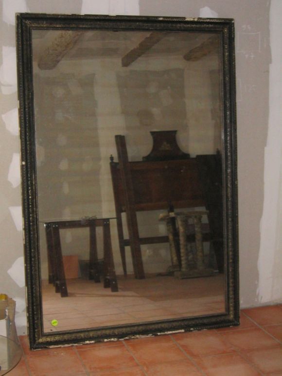 Large and stunning French Napoleon III ebonized and silver-leaved mirror for floor or wall with original mercury glass mirror.

This piece is located in France. Crating, shipping and insurance from France is additional.
