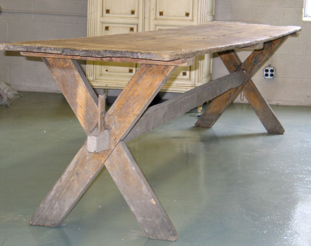 An Elegant Farm Table Formed by 2 X-frame Leg Supports.