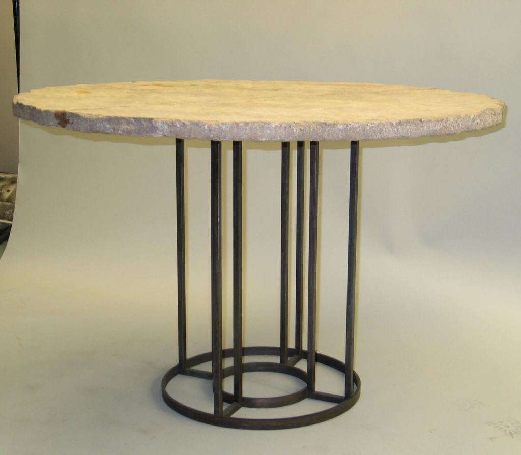 An elegant French Mid-Century Modern Style round dining / center table base in hand wrought iron in the style of Jean Royere. Diameter of the base is 20