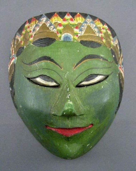 Pair of hand-carved and hand-painted ceremonial masks representing part of the cycle of eternal change. Each mask depicts a person in a multicolored ceremonial headress.