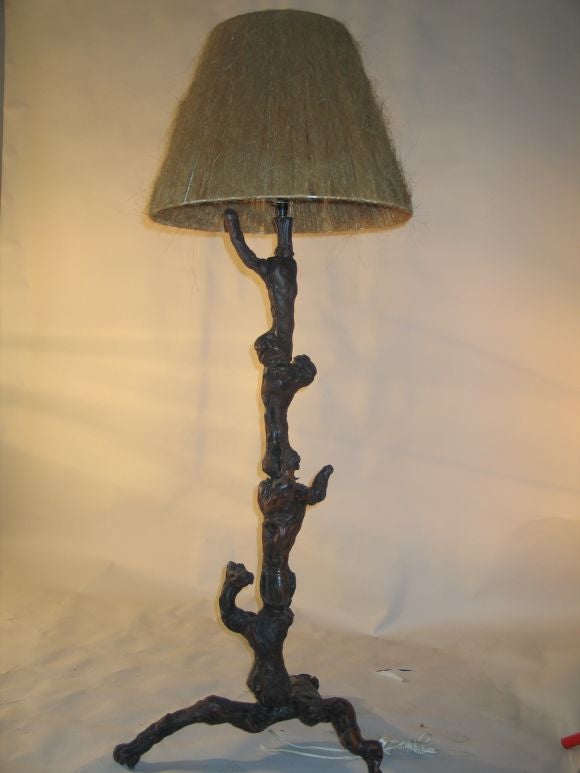 A Pair of rare and poetic French Mid-Century Modern Craftsman floor lamps, handmade from roots of trees and, hewn together into an organic, naturalist sculptural form. These unique, dramatic works express a reverence for nature while using the