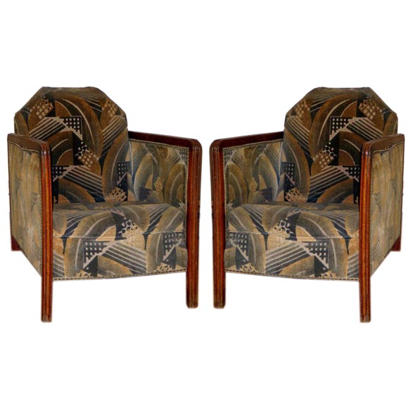 Elegant pair of French Art Deco/modern armchairs with the arms and legs formed by simple, angular lines creating sober, modern forms. 

The chairs are shown with original mohair velvet upholstery which can easily be changed.
