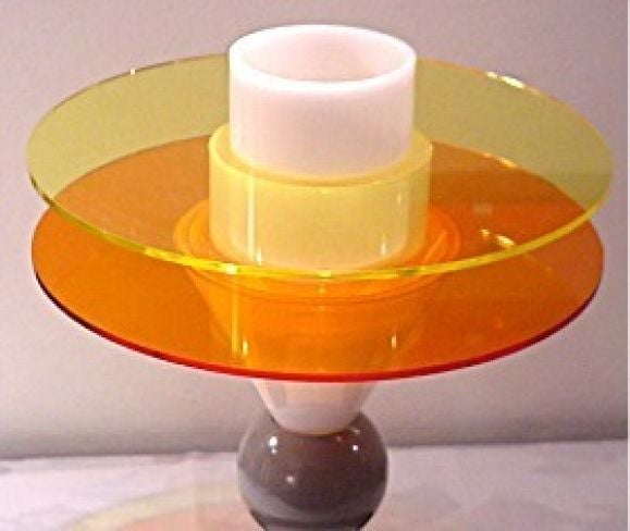 Innovative table or floor lamp by Sottsass representative of Memphis's Post-Modernist Whimsy. Light diffuses out of yellow, orange and white panels. Production limited to 250 pieces.