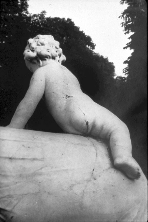 Large format poetic black and white photograph of a Versailles garden sculpture / cherub, circa 1995 by the "Boston School" artist, David Armstrong (1954-2014). 

Gelatin silver print, 1 of an edition of 3. Signed on verso.