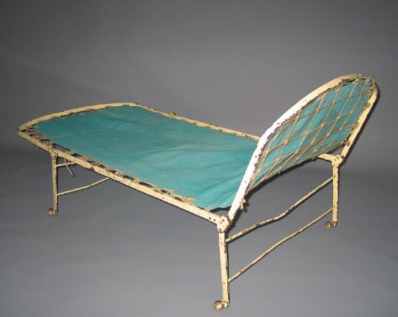 A rare 19th century French wrought iron Campaign bed circa 1870 having folding capacity and a replaced burlap platform. 

Comfortable and composed of hand-knotted rope frame tied on a painted metal base. Completely adjustable from every angle. Top